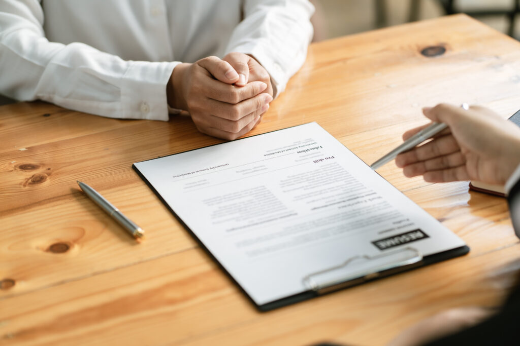 woman submit resume to employer to review job application. the c